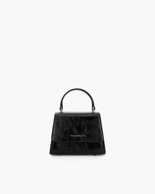 Sac ALEXIA NANO en naplak noir, vue de face, posé, avec poignée gainée