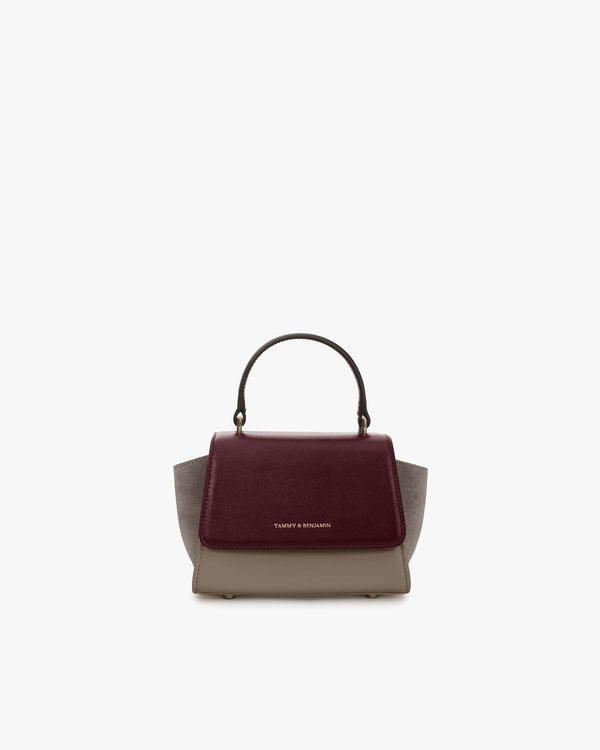 Sac ALEXIA NANO Colourblock Stratum, vue de face, poignée rigide, posé sur fond blanc
