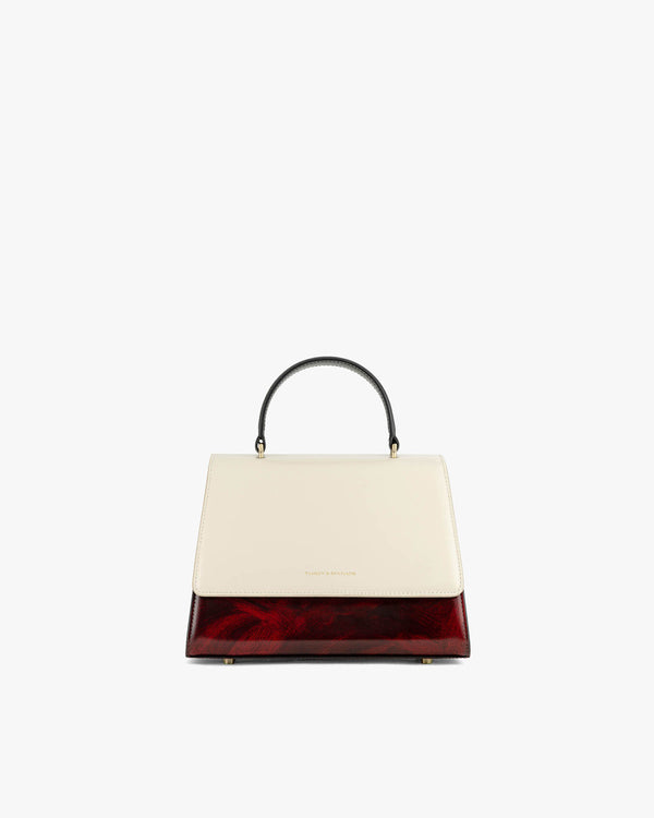 Sac ALEXIA colourblock art déco, vue de face, poignée gainée noire, posé
