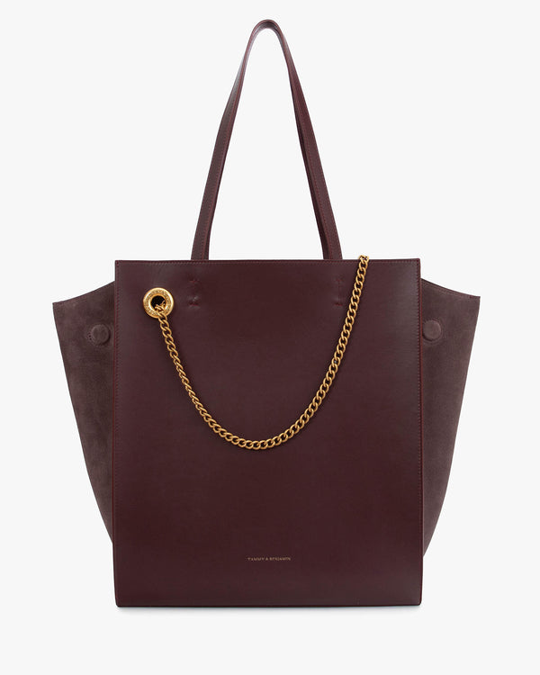 LEXI GM tote bag in Aubergine, front view with suede panels and removable gold chain