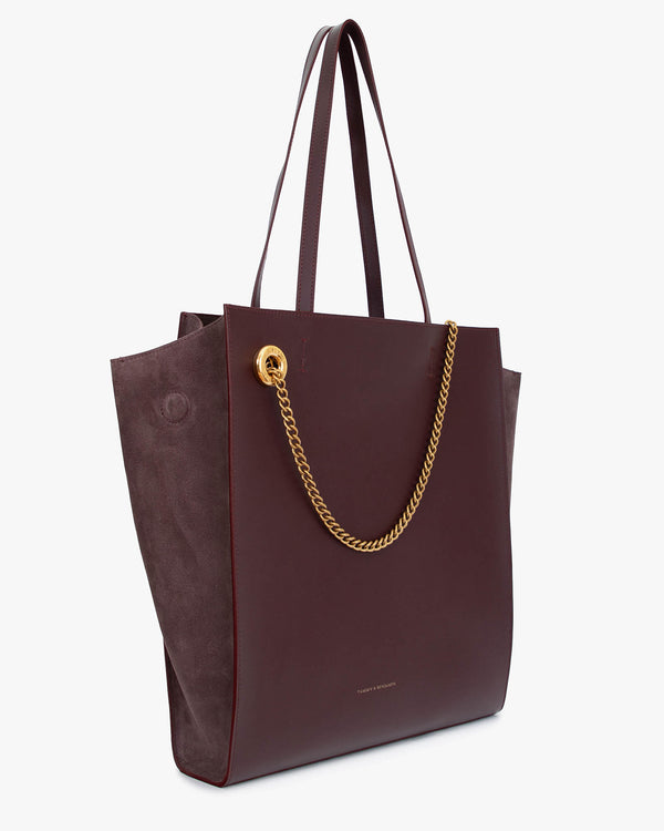 LEXI GM tote in Aubergine, three-quarter view, leather handles, removable gold chain, suede panels