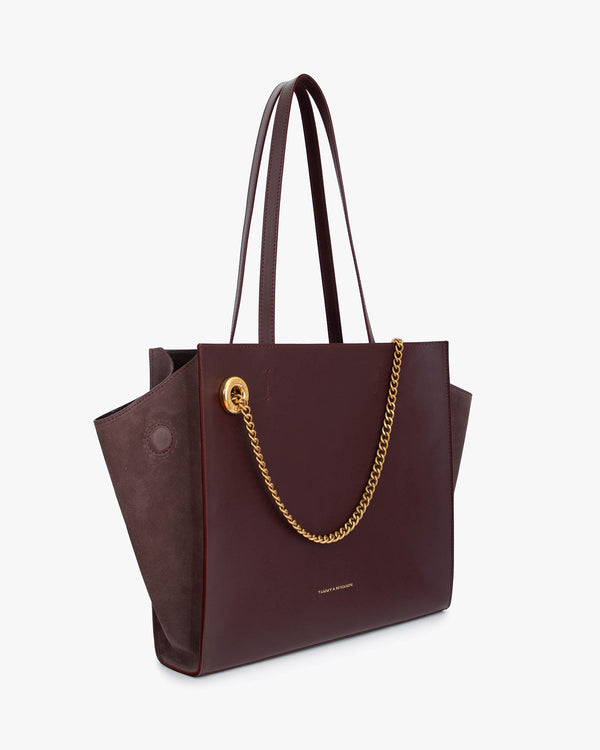 LEXI MM tote in Aubergine, side angle showing leather wings and suede panels with removable chain