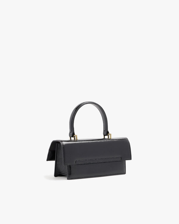 Sac THEA MINI noir naplak, vue de dos trois quarts, posé, rabat et anse apparents