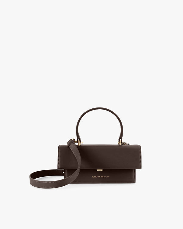 THEA MINI bag in Chocolate, front view, flap closed, top handle with detached crossbody strap