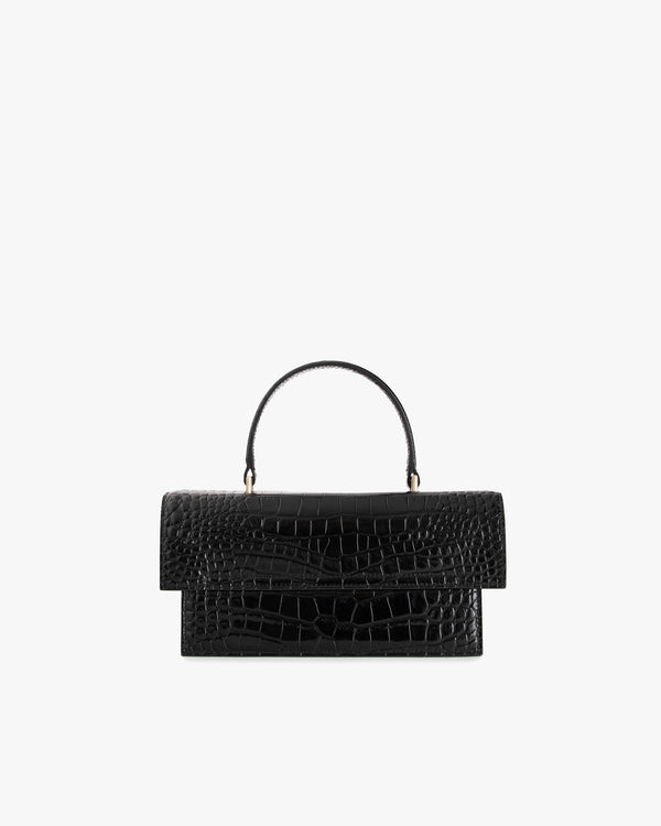 Sac THEA Noir embossé crocodile, vue de face, posé, avec poignée rigide
