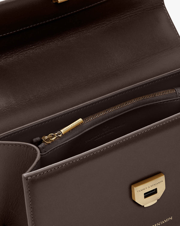 THEA bag in Chocolate, interior view showing zipped pocket and engraved gold clasp