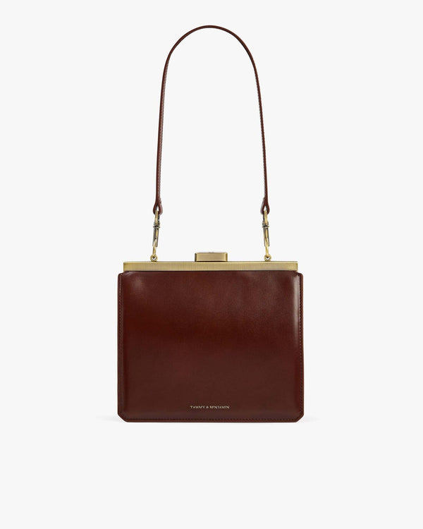 JEANNE bag in brown, front view, gold metal clasp, removable shoulder strap