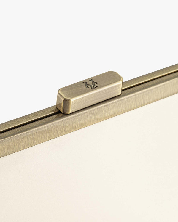 JEANNE bag in Ivory, close-up of the metal clasp engraved with a deer
