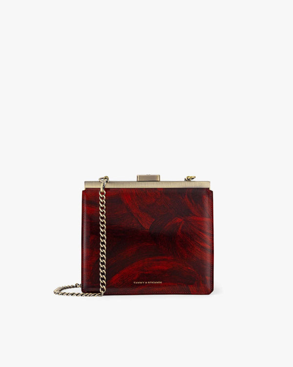JEANNE bag in Marbre, front view with gold metal clasp and removable chain