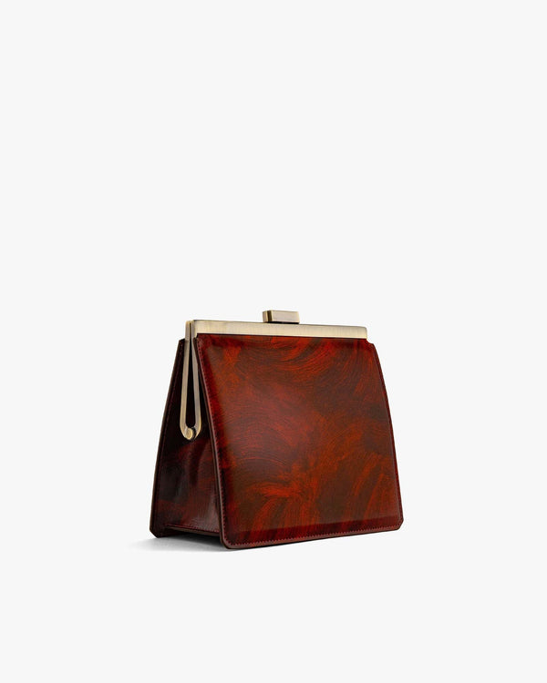 JEANNE bag in Marble, side view, gold-tone metal clasp and matching soft handle