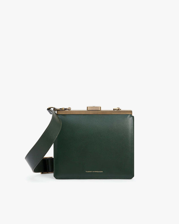 JEANNE bag in emerald green, front view, gold metal clasp, removable strap draped diagonally